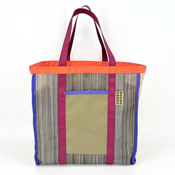 Multicolored woven tote bag with blue, maroon, and orange accents and an olive side pocket on a white background