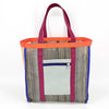 Multicolored tote bag with grey zip-top side pocket on a white background