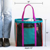 Multicolored tote bag with dimensions shown next to a person wearing jeans and boots.