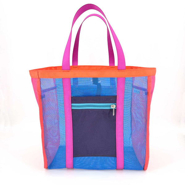 Multicolored mesh tote bag with pink handles and a navy zip-top side pocket on a white background