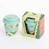 Reusable sippy cup with silicone lid and grip with dinosaur design in packaging, branded 'Chino Club'.