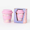 Pink reusable cup with unicorn design and matching lid, displayed with packaging on a white background.