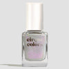 Cirque Colors white shimmergraphic nail polish bottle with a white cap on a light gray background