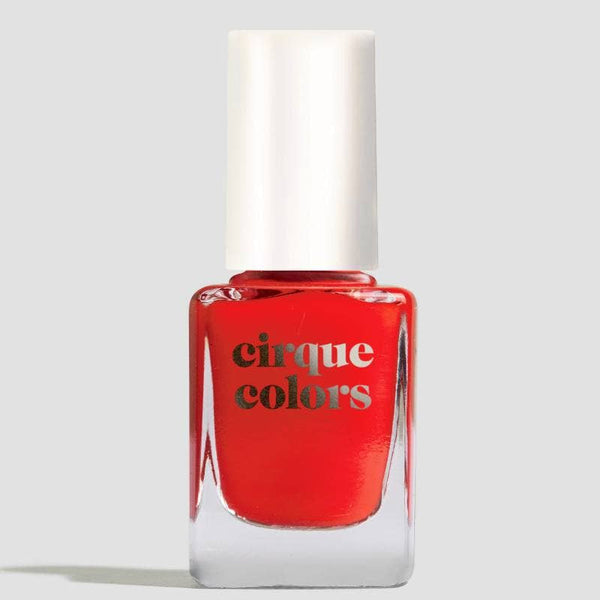 Red nail polish bottle with 'cirque colors' branding on a light gray background