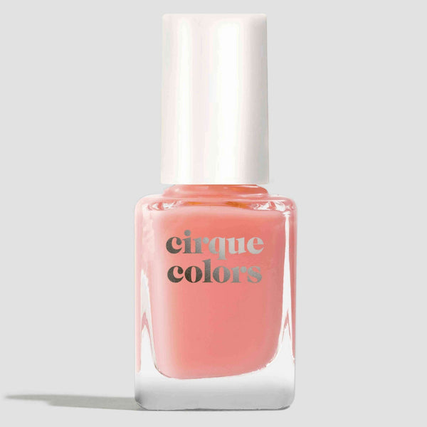 Pink nail polish bottle with 'cirque colors' branding on a light gray background