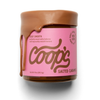 A jar of Coop's Salted Caramel with a pink label and faux dripping caramel topping, shown on a white background.