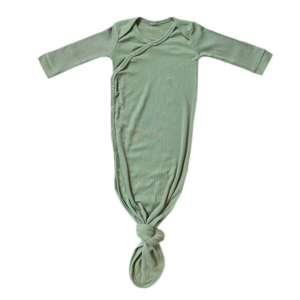 Green baby onesie on a white background