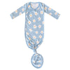 Baby swaddle with floral pattern on a light blue background
