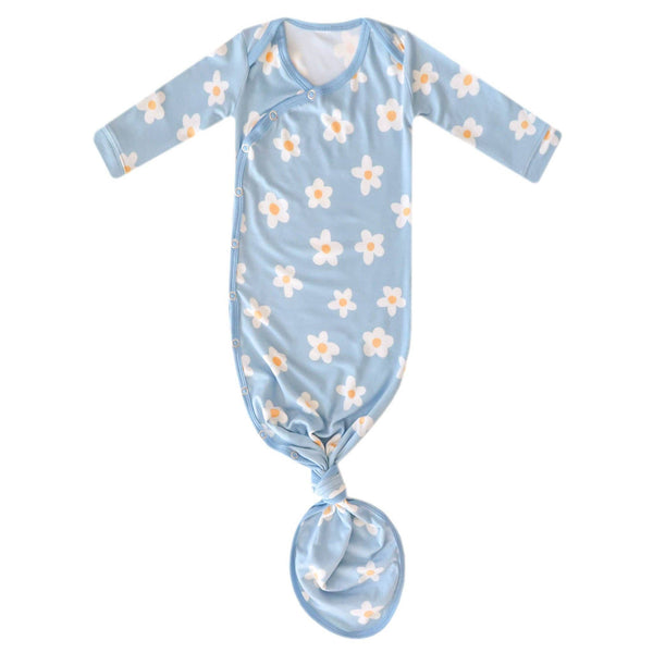 Baby swaddle with floral pattern on a light blue background