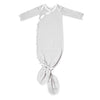 Grey and white striped baby gown with a knot at the bottom on a white background