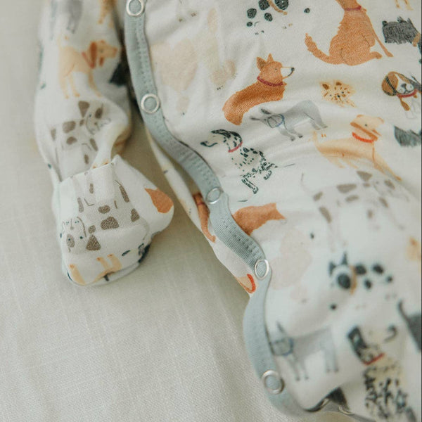 Baby swaddle with animal pattern showing detail of fold-over mitts on a light background
