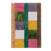 A vibrantly colored marbled resin serving board in a multicolor block pattern against a white background.
