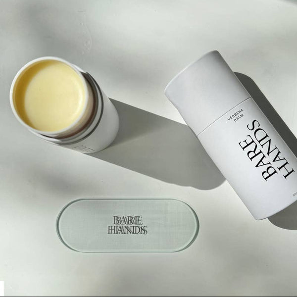 Two skincare products with 'Bare Hands' branding on a light surface.