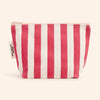 Red and white striped pouch on a beige background