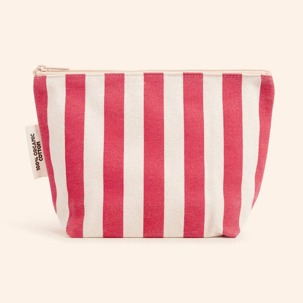 Red and white striped pouch on a beige background