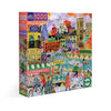 A 1000-piece jigsaw puzzle box featuring a colorful illustration of Paris in autumn, with landmarks, cyclists, a patisserie, and a river scene. The box is shown at a three-quarter angle on a plain white background.