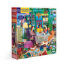 Puzzle box with a colorful illustration of a cozy café reading scene on a white background