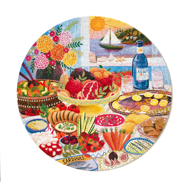 Round jigsaw puzzle with colorful illustrations of food, flowers, and a bottle of Agua.