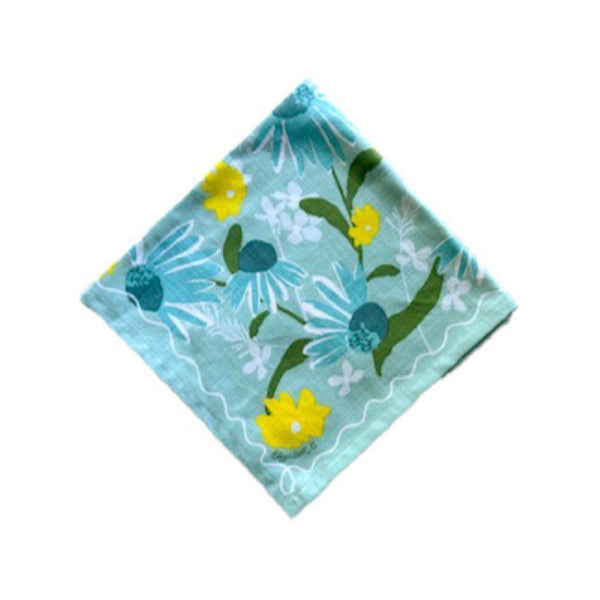 Blue and yellow floral patterned fabric  napkin square on a white background