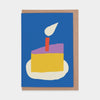 Greeting card with a slice of birthday cake and candle on a blue background