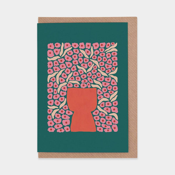 Greeting card with floral design and red vase silhouette on teal background