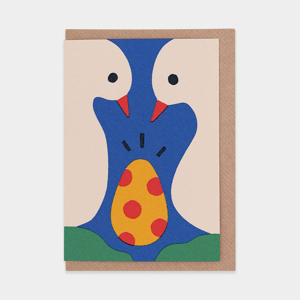 Greeting card with abstract design of two white birds holding a yellow and red polka dot egg.