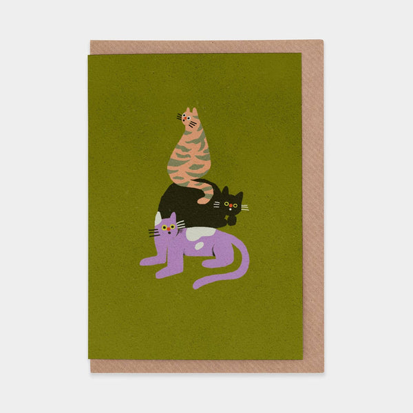 Greeting card with cartoon cats stacked on top of each other on a green background