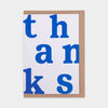 Card with 'thanks' in blue letters on a white background