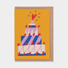 Colorful birthday cake illustration on a yellow card with a brown envelope.