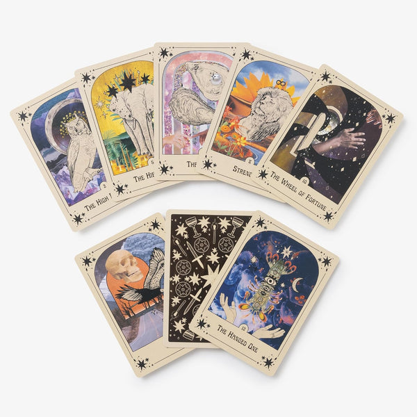 Set of tarot cards with various designs and symbols on a white background