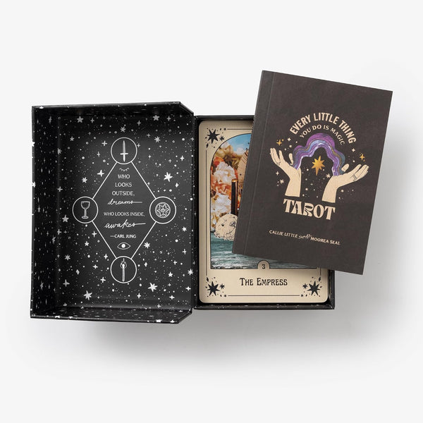 Interior view of a tarot deck box showing a guidebook and cards.