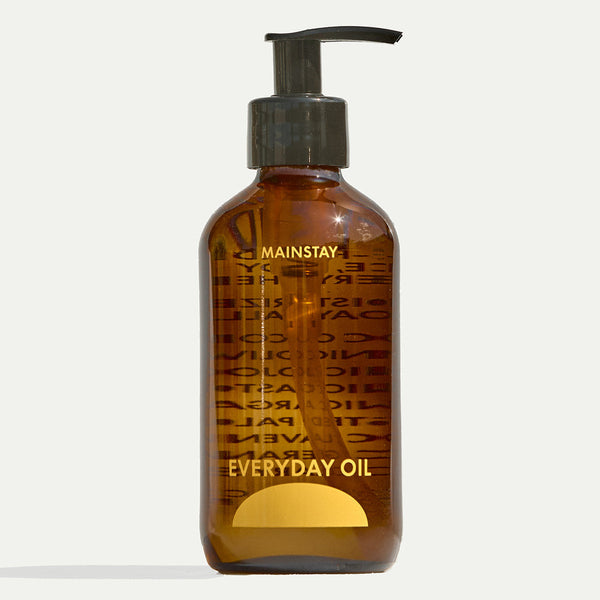 Brown bottle labeled 'Everyday Oil' and 'Mainstay' with pump on a white background