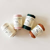 Four spools of linen twine with 'Flax & Twine' labels on a light background
