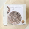Sunburst basket kit packaging with a woven basket design on a beige background