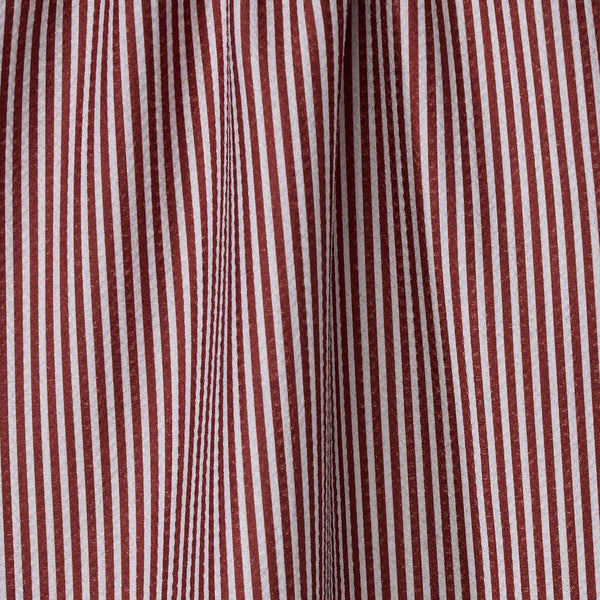 Close-up of a red and white vertically striped tea towel.