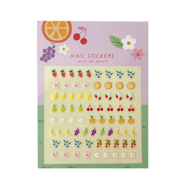 Nail stickers with fruit and flower designs in colorful packaging against a white background.