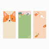 Three colorful notepads with dog illustrations on a white background