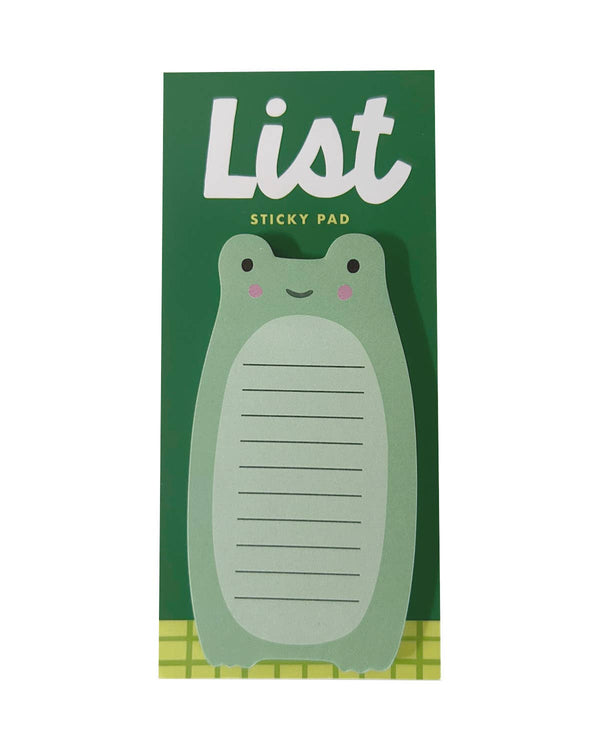 A green frog-shaped sticky pad with a smiling face, shown attached to its dark green backing card that reads 'List Sticky Pad'.