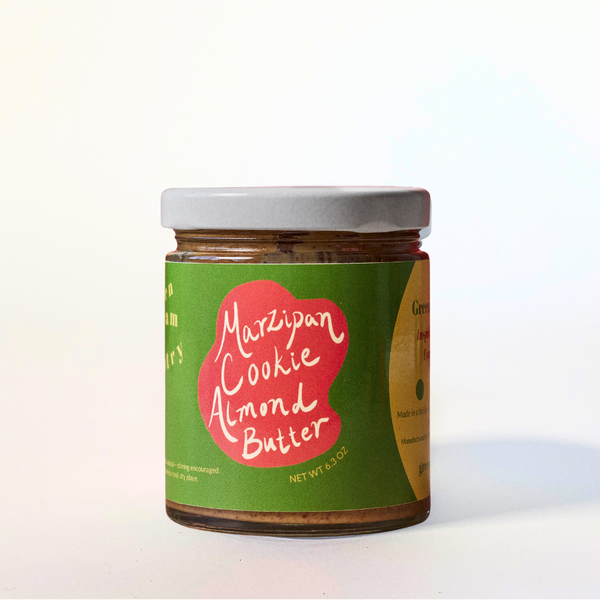 Jar of Marzipan Cookie Almond Butter with a green label on a white background