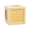 Cube-shaped honey soap with 'Fabrique a Marseille par Maitre Savonnier' text on a white background