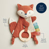 Fox-shaped soft toy with crinkle sound feature and textured ribbon on a light background