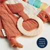 Detail of fabric fox sensory toy focused on a cream silicone teether ring.