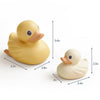 Two rubber ducks with measurements indicated on a white background