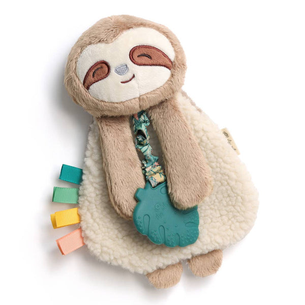 Plush toy sloth with a teether and colorful tags on a white background
