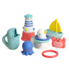 A set of colorful nautical-themed baby bath toys on a clean white background, including a whale-shaped cup, lighthouse, sailboat, octopus, seahorse, crab, and a red ring.