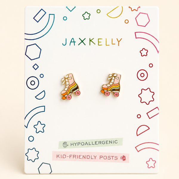 A pair of colorful roller skate stud earrings displayed on a white JAX KELLY brand card. The card features playful multicolor geometric line drawings and text indicating 'KID-FRIENDLY POSTS' and 'Hypoallergenic'.