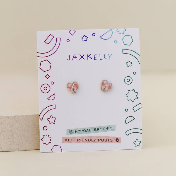 Jaxkelly bow-shaped enamel kid's earrings on a branded card with geometric design
