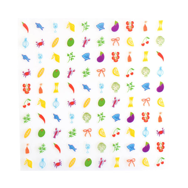 A square sheet of clear adhesive nail stickers decorated with a colorful grid of small food and drink illustrations, including lemons, cherries, pasta, crabs, and flowers, shown on a plain white background.