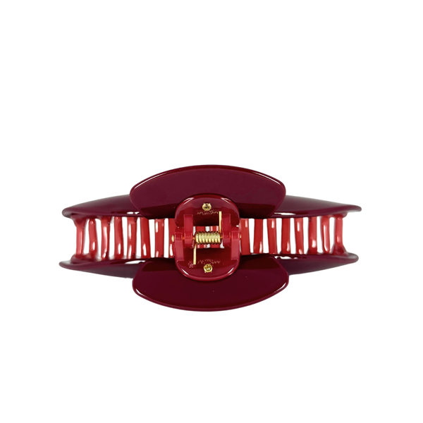 A glossy deep red hair claw clip with a gold metal spring and screw mechanism, shown against a solid white background.