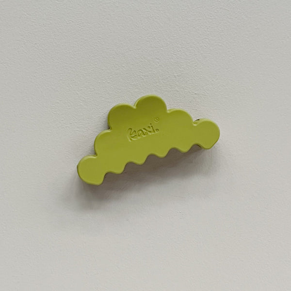 A pear green cloud-shaped hair claw clip with the brand name 'Kaxi' embossed on the top, shown against a plain light gray background.